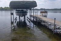 Kasco AquatiClear Water Circulator installed near a boat lift and dock to improve water movement around the shoreline