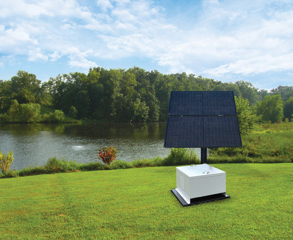 Nightair solar aerator with solar panel system with battery storage in a grassy area near a body of water.